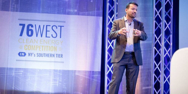 Arun Gupta stands on the stage at a competition