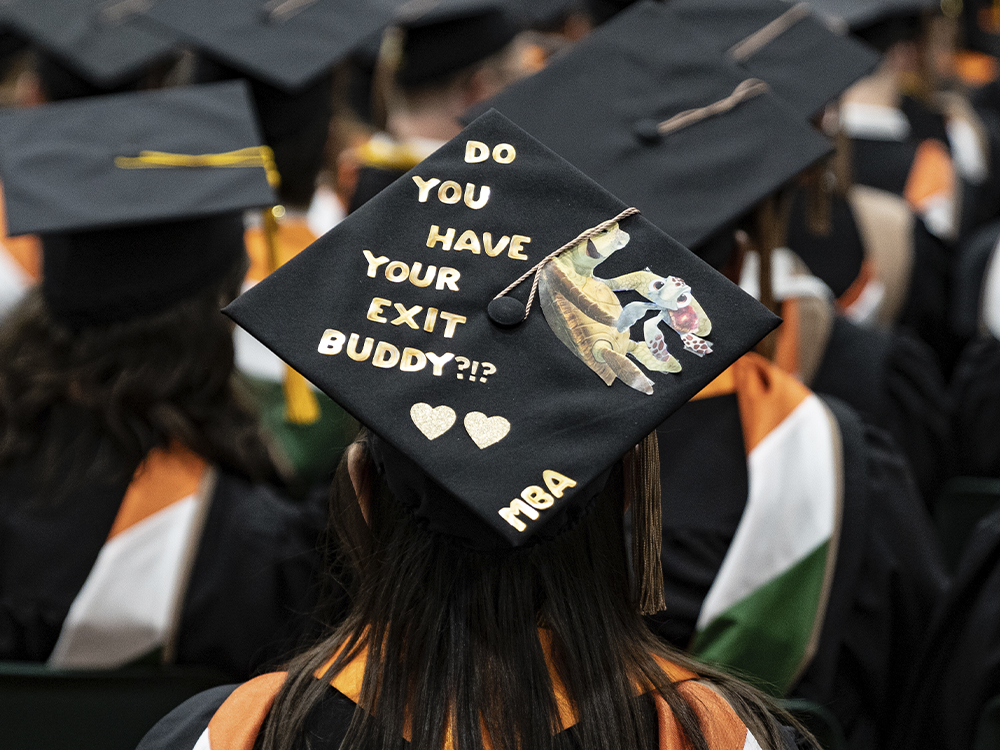 Woman wearing a cap that says do you have your exit buddy