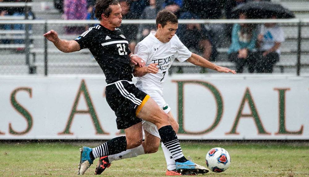 A rainy day soccer game.